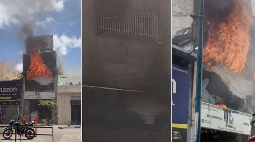 Los Bomberos de Caracas combaten el incendio para que no se propague a los edificios aledaños, en la Av. principal de El Cementerio. Fotos capturas de pantalla RRSS